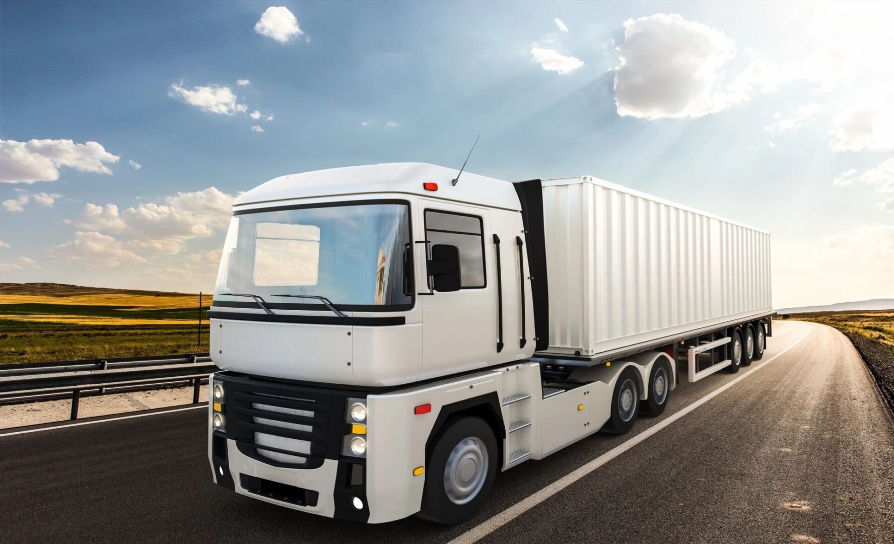 A white truck is driving down the road.