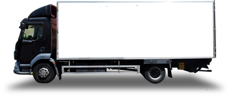 A white truck is parked in the dark.